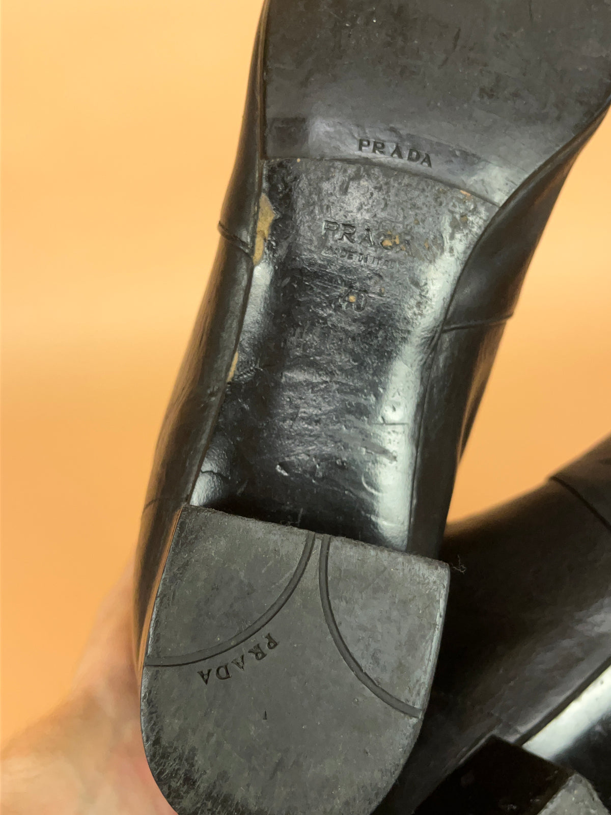 Y2K Prada crinkled black leather knee-high boots with gold-tone zip pull — Arkive Vintage