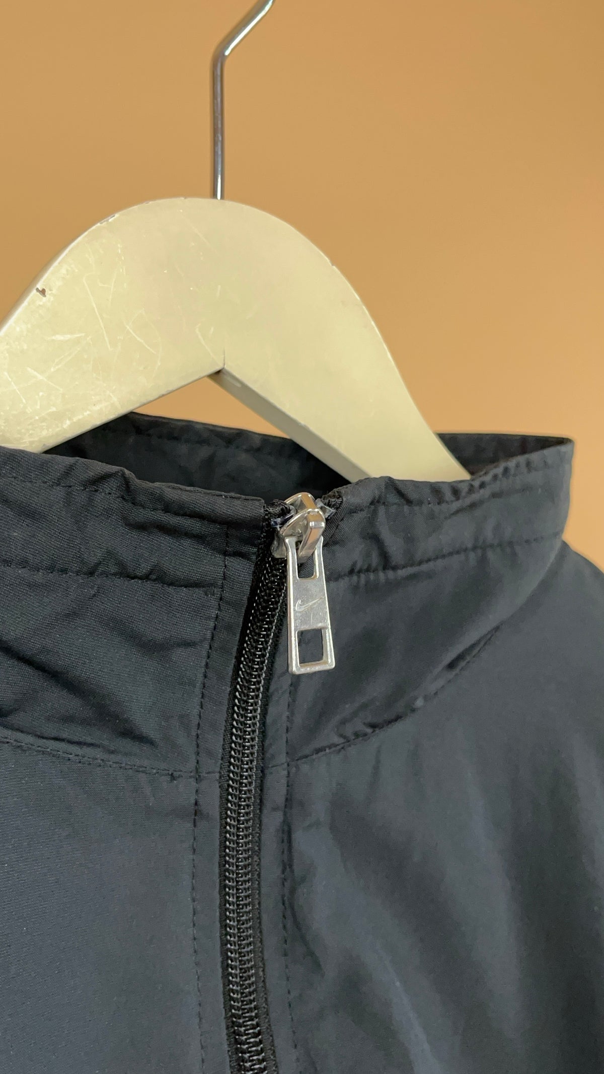 Vintage Nike black windbreaker with white stripe detail — Arkive Vintage