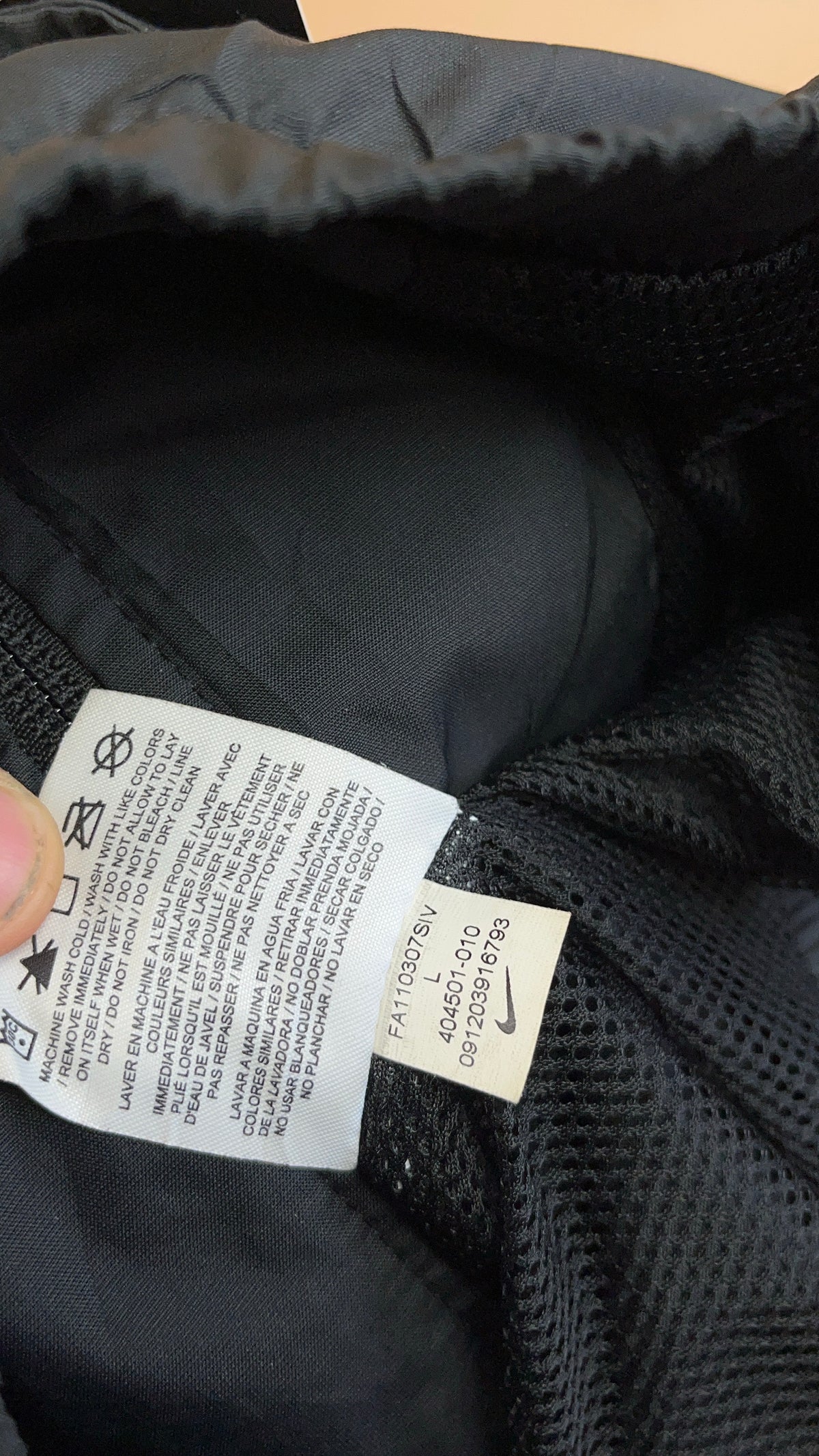 Vintage Nike black windbreaker with white stripe detail — Arkive Vintage