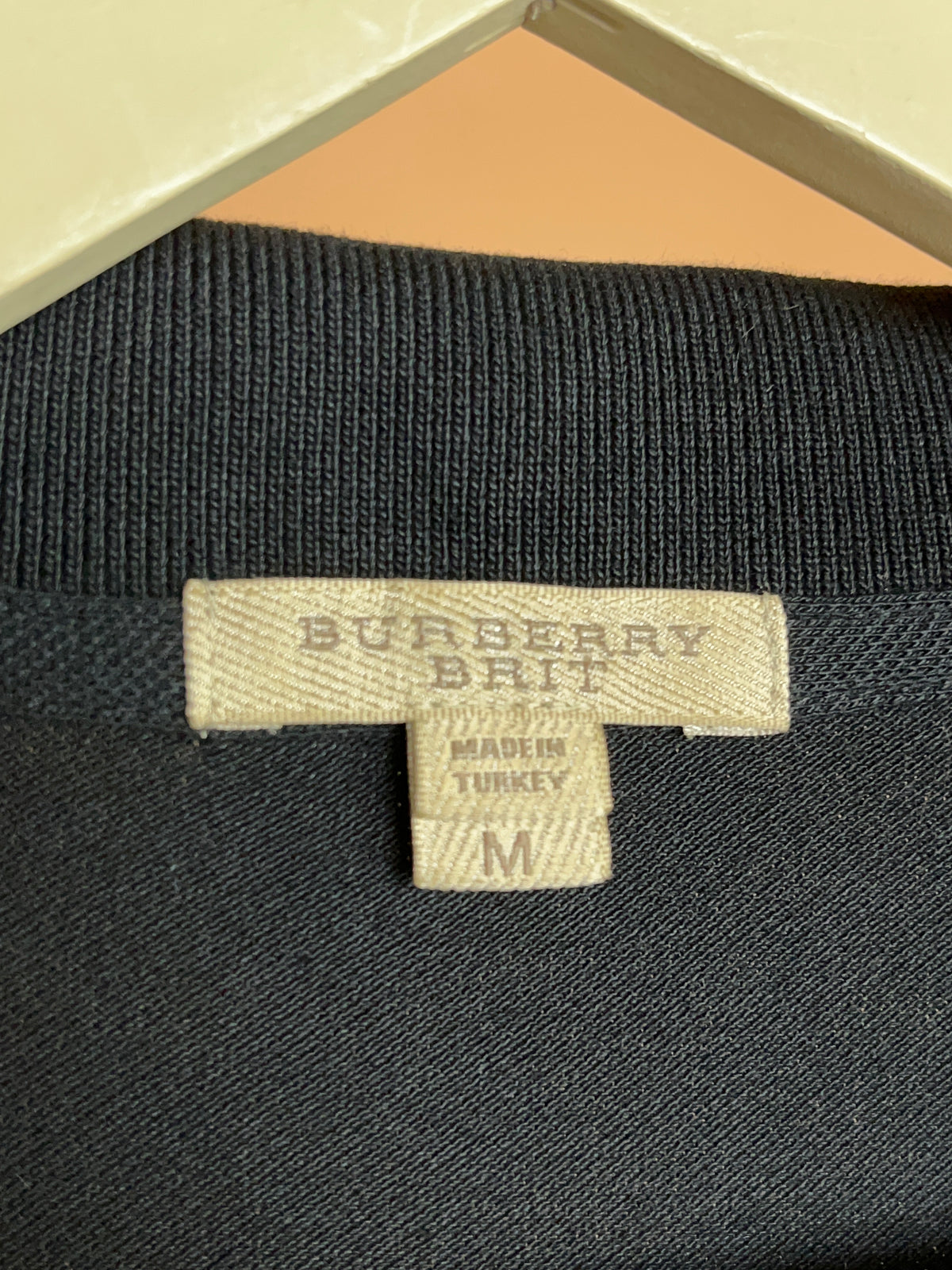 Y2K Burberry Brit black cotton pique V-neck polo, Nova check placket — Arkive Vintage