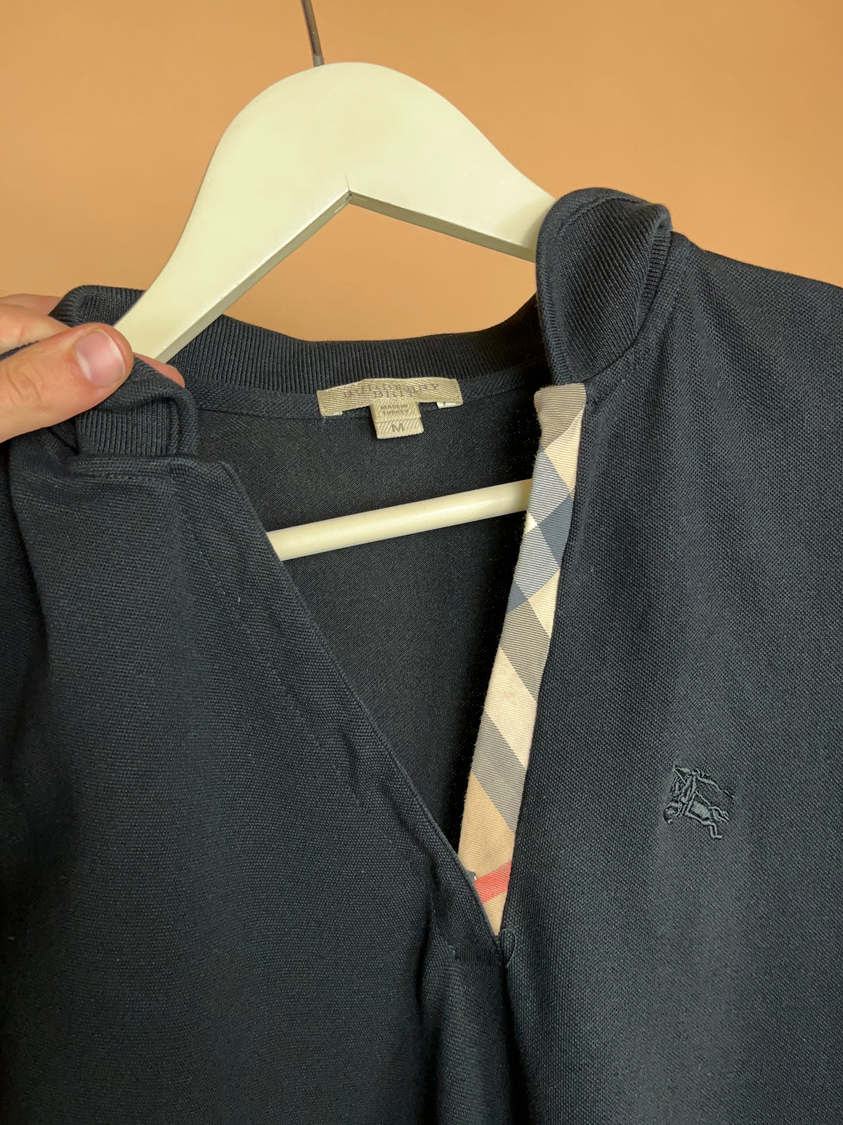 Y2K Burberry Brit black cotton pique V-neck polo, Nova check placket — Arkive Vintage
