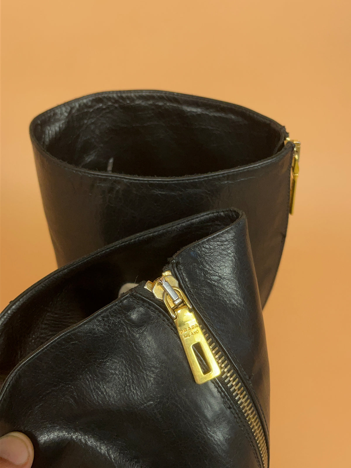 Y2K Prada crinkled black leather knee-high boots with gold-tone zip pull — Arkive Vintage