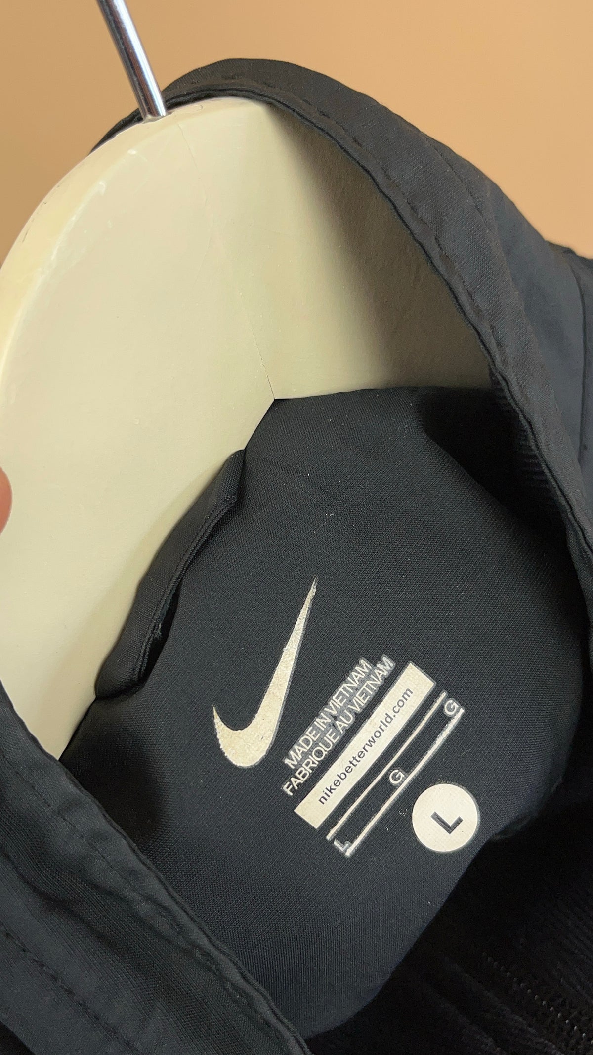 Vintage Nike black windbreaker with white stripe detail — Arkive Vintage