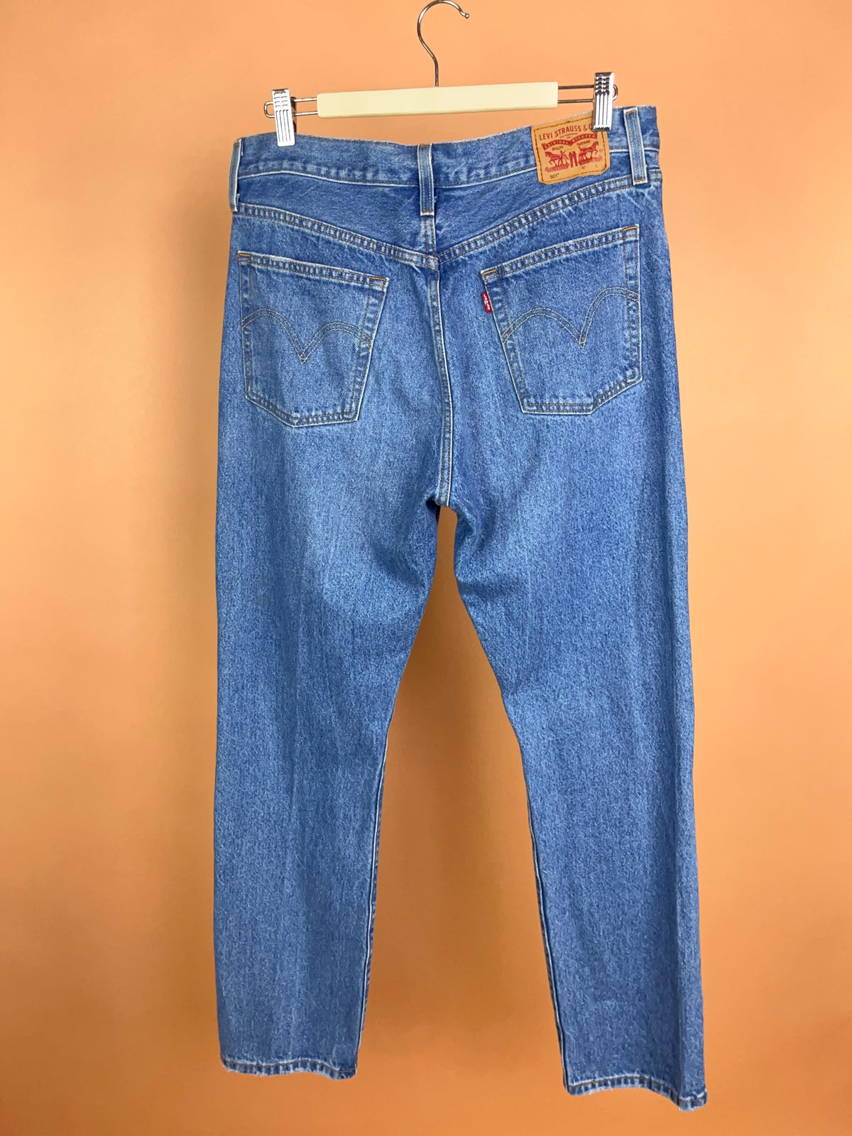 Levi's 501 mid blue straight leg jeans, intentional knee distressing — Arkive Vintage