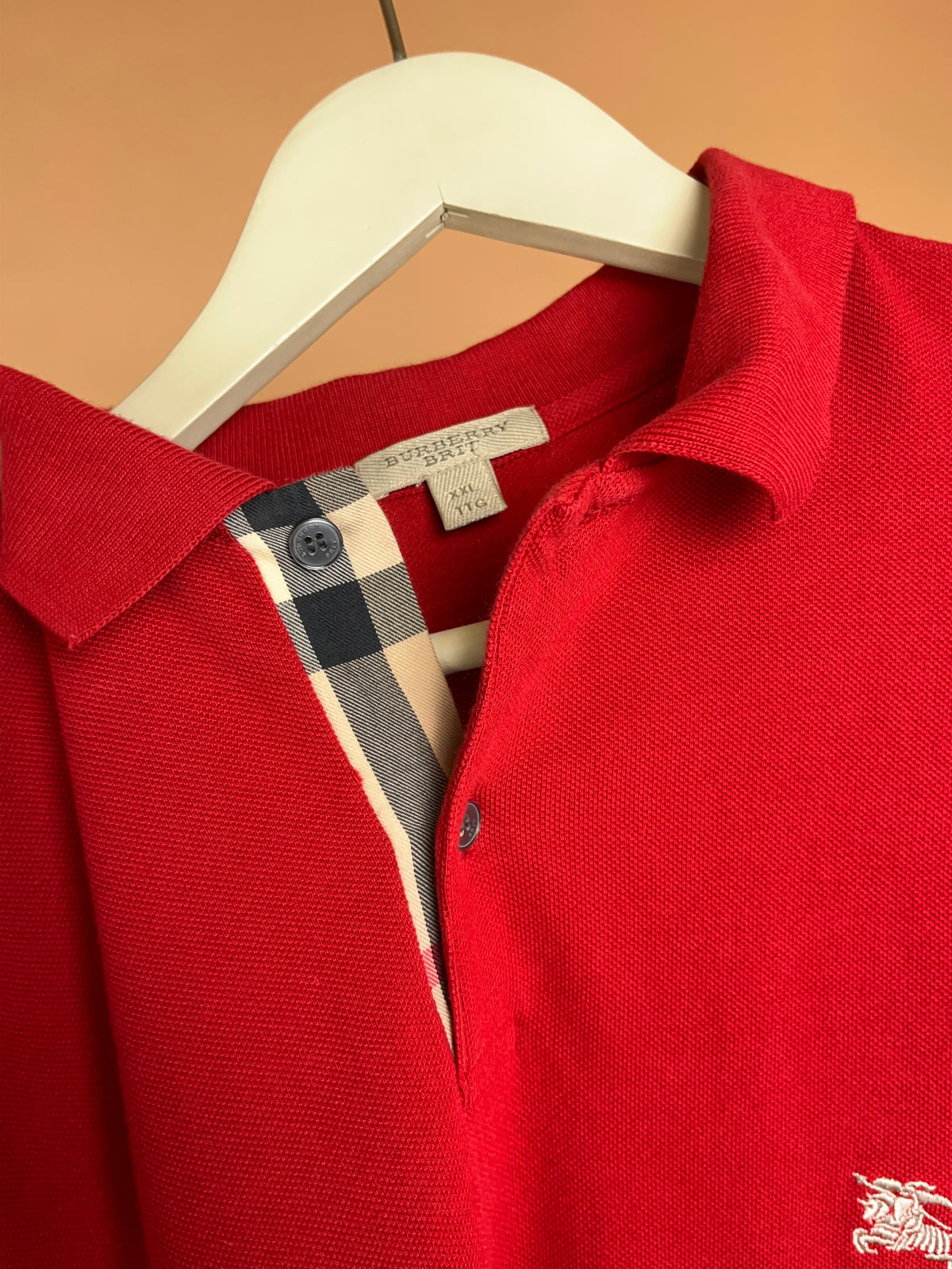Y2K Burberry Brit red cotton polo shirt with Nova check hem vents — Arkive Vintage