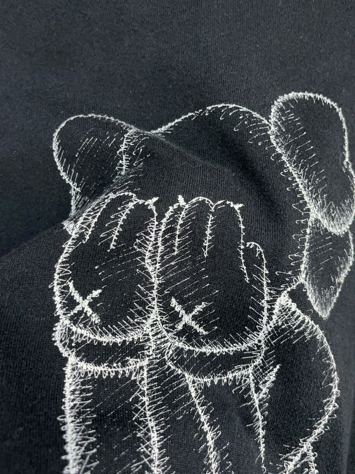 Y2K KAWS x Original Fake black graphic t-shirt with signature figure — Arkive Vintage